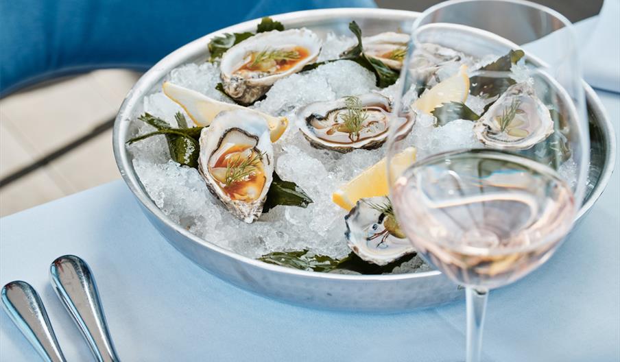 oysters served with wine at Sumas Restaurant