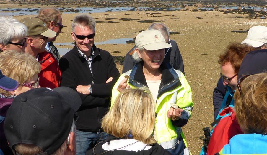 group and a guide getting ready to do a walk along the beach with Jersey Walk Adventures