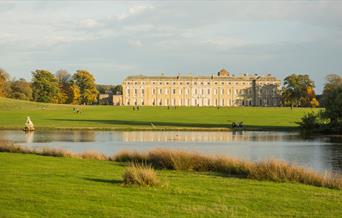 A view across the lake towards the house at Petworth House & Park