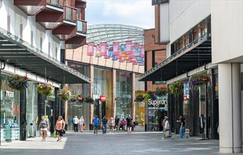 Shoppers walking through the Princesshay Shopping Centre