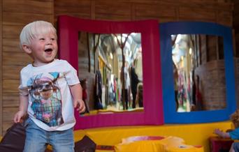 Small boy playing at Farmer Palmer's