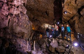 A group on a tour of Poole’s Cavern & Country Park