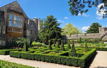 The gardens and outside of the Bishop’s Palace on a sunny day