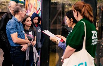 Deaf Led BSL Tour at London Zoo – Group of people watching a Deaf Presenter signing