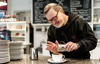 A man making at Hot Chocolate at Beresford Street Kitchen