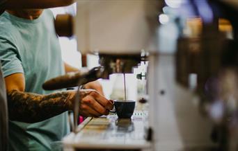 Barista preparing coffee at Locke’s