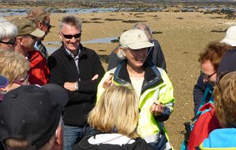 group and a guide getting ready to do a walk along the beach with Jersey Walk Adventures