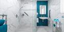 sara's cottage bathroom showing a wet room style shower