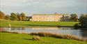 A view across the lake towards the house at Petworth House & Park