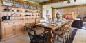 Dining area with long table at Asheston Eco Barns