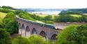 GWR train travelling over a viaduct