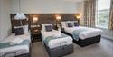 Room with three beds and a hoist at Marsham Court Hotel