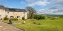 Grounds surrounding Asheston Eco Barns on a summer's day