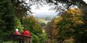 couple sat on a bench enjoying the view at Batsford Arboretum & Garden Centre