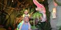 A dad and child in the dinosaur section at Yorkshire Wildlife Park