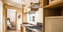 Kitchen and entry way at one of the properties at John Fowler Holiday Parks