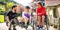 Visitors using accessible bikes at wheelchairs at Dalby Forest