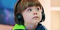 A child wearing headphones at Clarks village