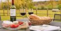 picnic with wine outside the property at The Granary, Larkbeare Grange