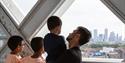 A family looking over views of London from Tower Bridge