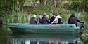 people on a boat at WWT Martin Mere Wetland Centre