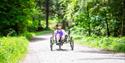 person riding accessible bike at Dalby Forest