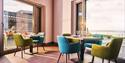 Dining and bar area at Caban with sea views
