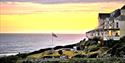 View of the outside of Watersmeet Hotel looking out to sea