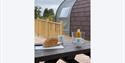 Bread on a picnic table outside the glamping pods at Experience Freedom Glamping at Troutbeck Head