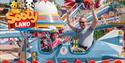 A parent and child on a plane ride at Crealy Theme Park with a Sooty Land logo over the top left corner