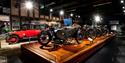 a selection of vintage bikes and cars at Coventry Transport Museum