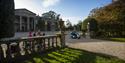 Person in wheelchair and others walking around the front of the house at Mount Stewart – National Trust ©National Trust Images/Chris Lacey