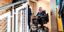 A person in a wheelchair waiting for the lift at WWT Slimbridge Wetland Centre
