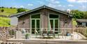 Accessible lodge at Hoe Grange holidays showing the decking with seating