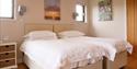 twin beds at The Granary, Larkbeare Grange