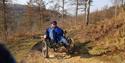 man exploring with accessible bike at Dalby Forest Cycle Hub CIC