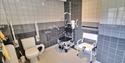 Wet room with shower chairs at Braunton Accessible Bungalow