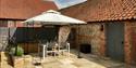 Shaded area in the courtyard a tSparham Hall Farm Holidays