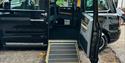 Taxi4Hire's side door open with a ramp up into the cab
