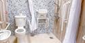 Accessible bathroom with shower chair at Beverley Holidays