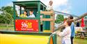 Children playing in a combine harvester at the play area at Fairytale Farm