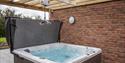 Hot tub with hoist at Brickhouse Farm Cottages