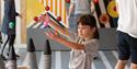 A child interacting with the displays at Xplore! Science Discovery Centre