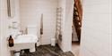 Bathroom at Sandhole Cottages with a sink adapted for wheelchair users