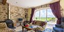 Sitting room with countryside views at Asheston Eco Barns
