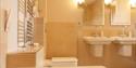 view from bath in bathroom featuring two sinks ar The Granary, Larkbeare Grange