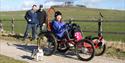 Guests at Hoe Grange Holidays, with one person in a tramper with a small jack russell by the side