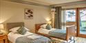 Twin beds at Homelands Trust