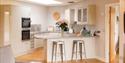 breakfast bar in kitchen at The Granary, Larkbeare Grange