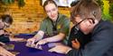 ranger at Hertfordshire Zoo working with children with hearing aids